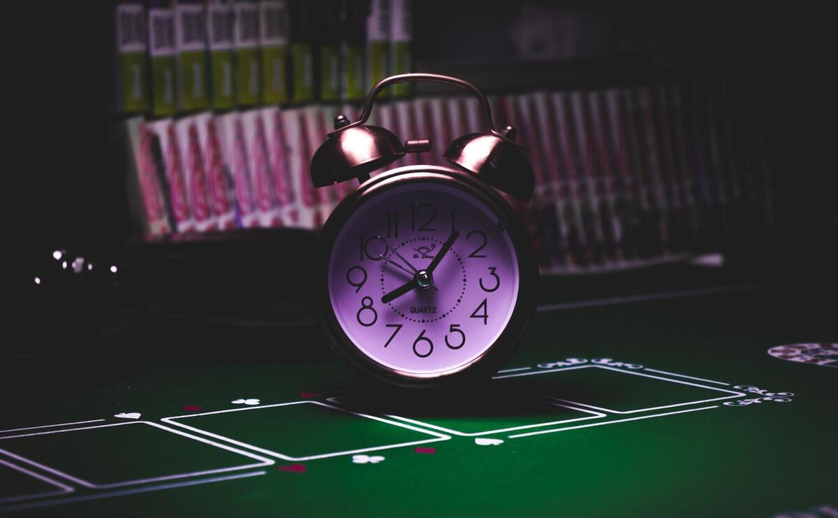 Close-up picture of a clock on a table.