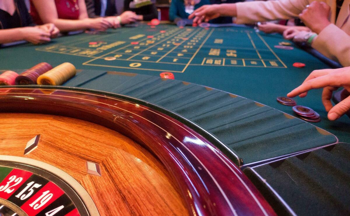 Roulette table in a crowded casino.