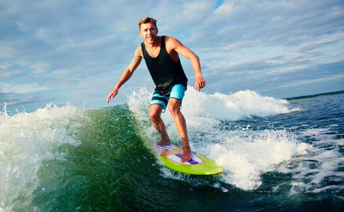 Surfer on blue ocean wave