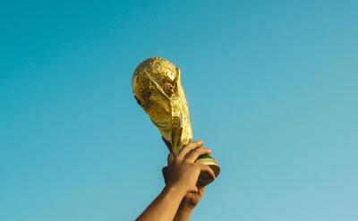 Person is raising the world cup.