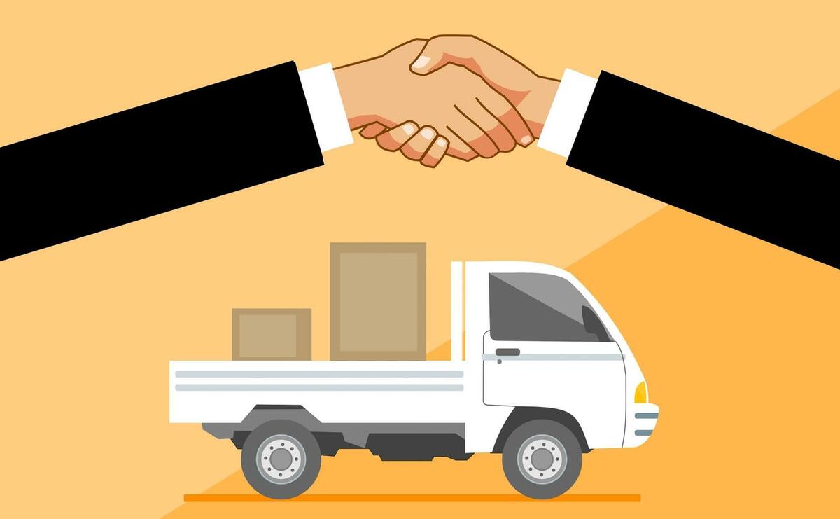 An illustration of two hands shaking hands in front of a truck.
