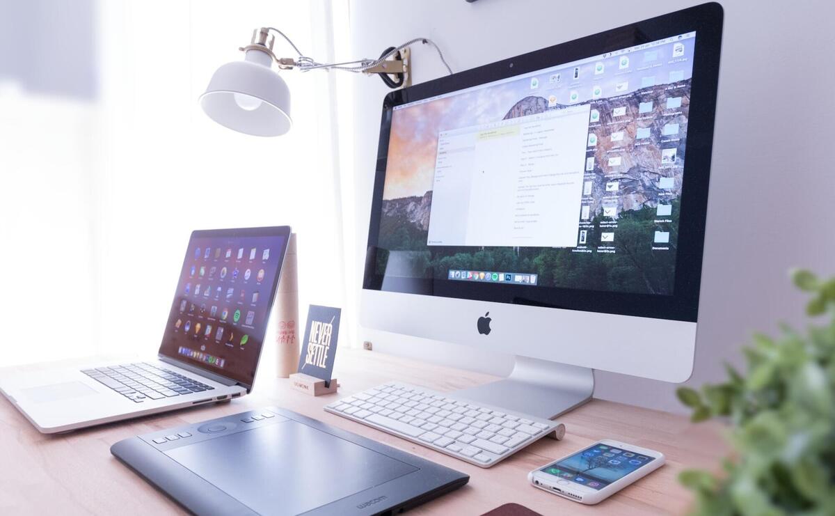 MacBook Pro on a wooden desk.