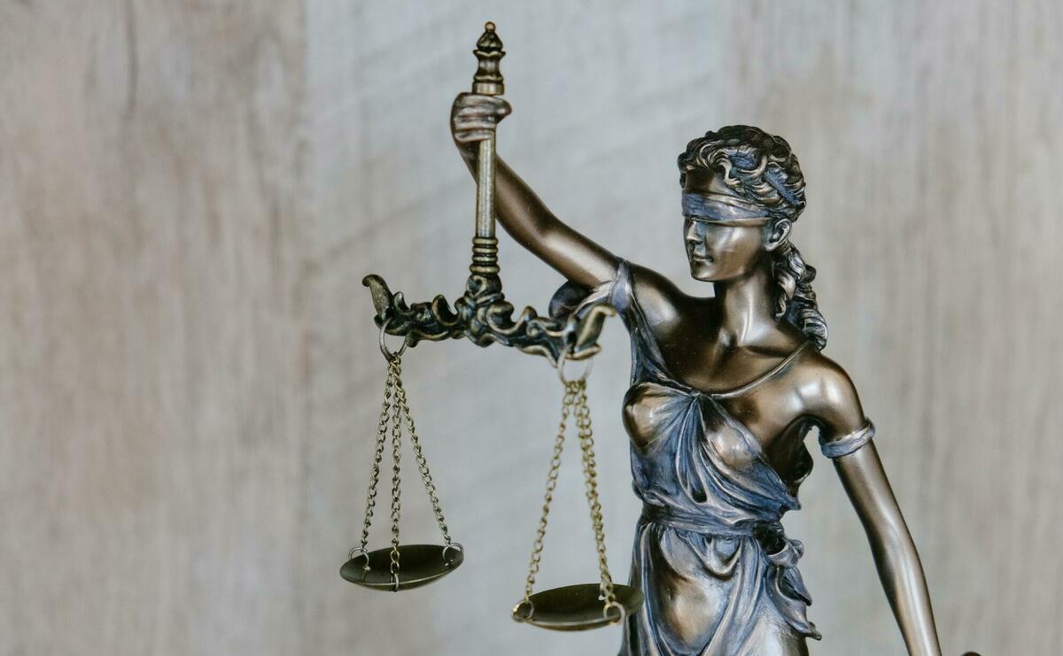 Lady Justice holding the scale and a sword.