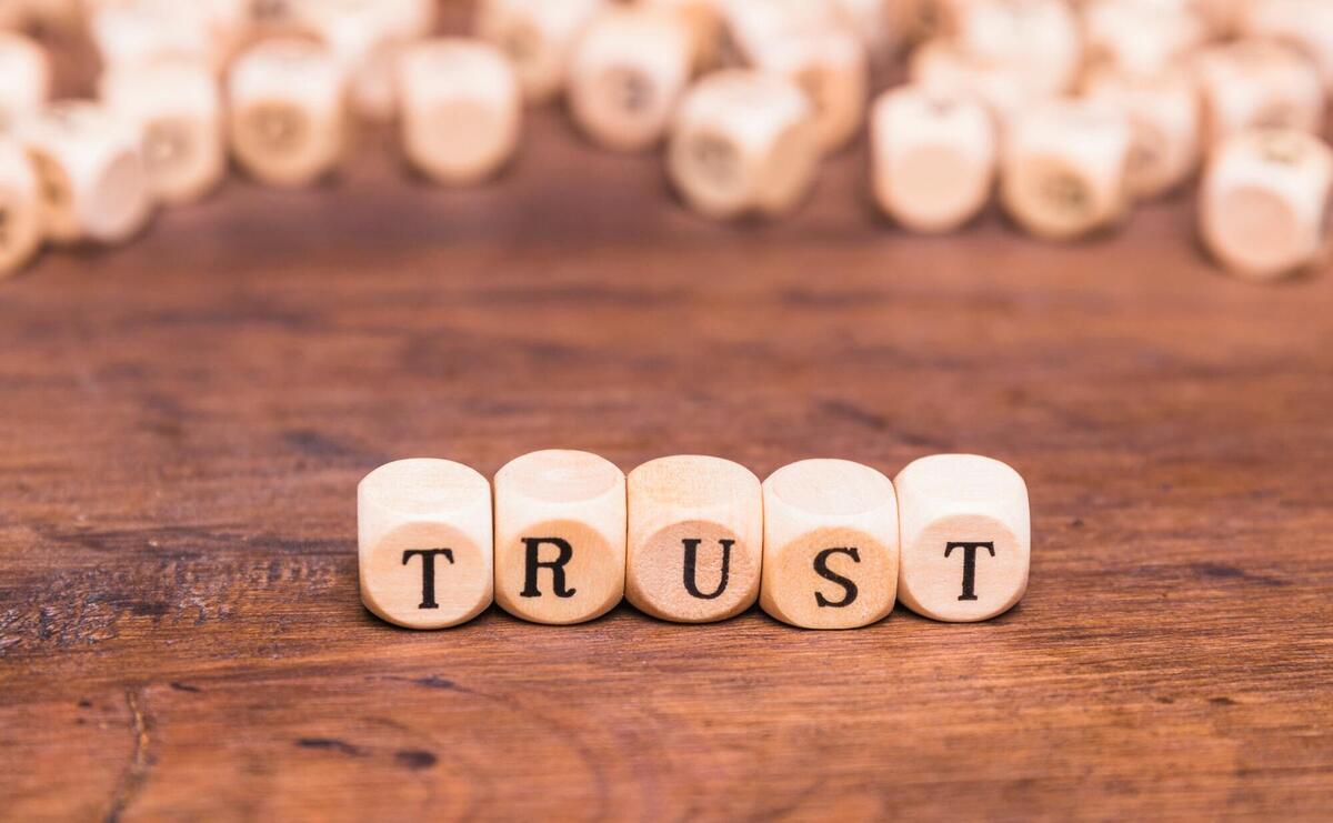 Trust word made with wooden blocks.