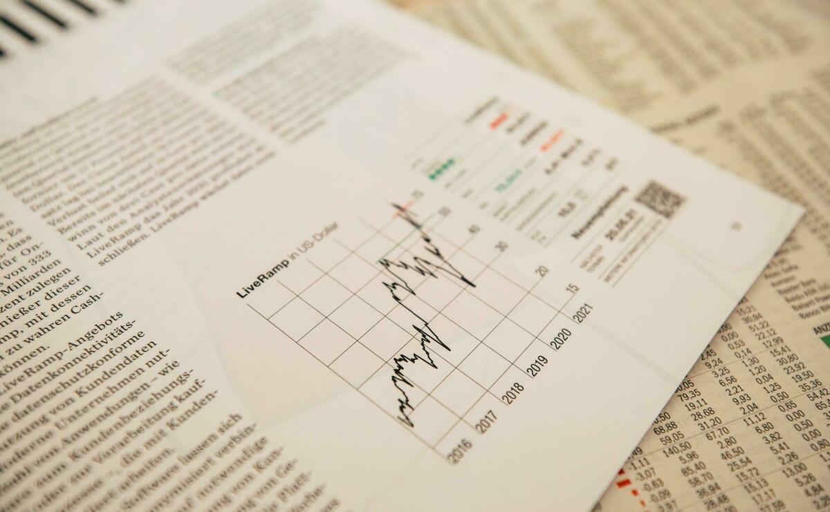 Papers on a table showing charts.