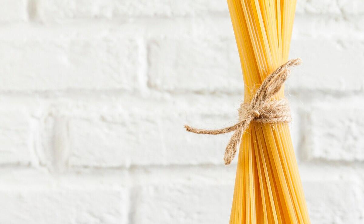 Close-up of spaghetti tied with a rope